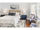 Comfortable bedroom featuring neutral tones, a large window, and stylish decor at 21069 Woodside Ln, Parker, CO 80138