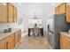 Dining area adjacent to kitchen with seating for four and bright natural light at 21069 Woodside Ln, Parker, CO 80138