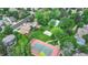 Aerial view of a residential community with homes, green spaces, pool, tennis court, and basketball court at 6581 E Heritage Pl, Englewood, CO 80111