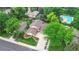A stunning aerial view of the charming single-story home with a well-manicured front yard and mature trees at 6581 E Heritage Pl, Englewood, CO 80111