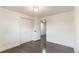 Bedroom with hardwood floors, closet storage and minimalist design at 6581 E Heritage Pl, Englewood, CO 80111