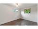 Bright bedroom featuring hardwood floors and natural light at 6581 E Heritage Pl, Englewood, CO 80111