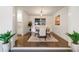 Elegant dining room with a modern chandelier and hardwood floors at 6581 E Heritage Pl, Englewood, CO 80111