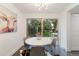 Bright dining area with backyard access, modern lighting, and stylish decor at 6581 E Heritage Pl, Englewood, CO 80111