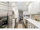 Contemporary kitchen with stainless steel appliances and ample cabinet space at 6581 E Heritage Pl, Englewood, CO 80111