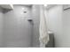 Modern shower with tiled walls, niche, and shower head at 6581 E Heritage Pl, Englewood, CO 80111