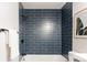 Updated bathroom features a sleek tiled shower with matte black fixtures at 1024 Stuart St, Denver, CO 80204