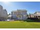 Spacious backyard with artificial turf, a storage shed, and patio area for outdoor living at 176 S Pembrook St, Castle Rock, CO 80104