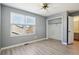 Bright bedroom with wood floors, ceiling fan, large closet and a view from the window at 176 S Pembrook St, Castle Rock, CO 80104