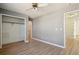Neutral bedroom offers wood-look floors and a large closet for ample storage at 176 S Pembrook St, Castle Rock, CO 80104