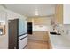 Updated kitchen with sleek cabinetry, black appliances, and ample counter space at 176 S Pembrook St, Castle Rock, CO 80104