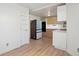 Bright kitchen with light wood cabinets, stainless steel appliances, and wood-look floors at 176 S Pembrook St, Castle Rock, CO 80104