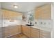 Modern kitchen featuring stylish wood cabinetry and stainless steel appliances at 176 S Pembrook St, Castle Rock, CO 80104