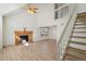 Bright and airy living room with a fireplace and staircase, perfect for entertaining at 176 S Pembrook St, Castle Rock, CO 80104