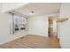 Bright living room boasts a cozy fireplace, vaulted ceilings, and beautiful wood-look floors and lots of natural light at 176 S Pembrook St, Castle Rock, CO 80104