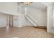 Bright living room boasts a cozy fireplace, vaulted ceilings, and beautiful wood-look floors and lots of natural light at 176 S Pembrook St, Castle Rock, CO 80104