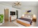 Main bedroom with a ceiling fan, TV, and art at 176 S Pembrook St, Castle Rock, CO 80104