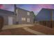 A spacious backyard featuring a patio seating area and fresh mulch at 19481 E Milan Cir, Aurora, CO 80013