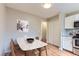 Cozy dining room with stylish table open to kitchen area at 19481 E Milan Cir, Aurora, CO 80013