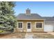 Charming stone-front home with a well-manicured yard and a classic, inviting entryway at 19481 E Milan Cir, Aurora, CO 80013