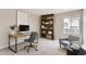 A stylish home office is furnished with a sleek desk, chair, bookcase, and comfortable seating area at 19481 E Milan Cir, Aurora, CO 80013