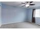 Spacious bedroom with ceiling fan, plush carpet, and lots of natural light at 11149 Gaylord St, Northglenn, CO 80233