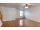 Open living space with hardwood floors, lots of natural light, and white painted walls at 11149 Gaylord St, Northglenn, CO 80233