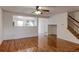 Bright living room featuring hardwood floors, modern ceiling fan, and an open floor plan at 11149 Gaylord St, Northglenn, CO 80233