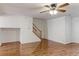 Inviting living area with hardwood floors and a classic wood staircase at 11149 Gaylord St, Northglenn, CO 80233