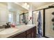 Bathroom with a double vanity, granite countertop, and shower at 4343 S Nepal Ct, Centennial, CO 80015