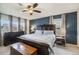 Spacious bedroom with a king-size bed and dark wood furniture at 4343 S Nepal Ct, Centennial, CO 80015