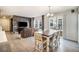 Open concept dining area with wooden table and chairs at 4343 S Nepal Ct, Centennial, CO 80015