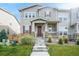 Two-story townhome with front porch and landscaping at 4343 S Nepal Ct, Centennial, CO 80015