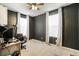 Bright home office features two windows, ceiling fan, and carpeted floor at 4343 S Nepal Ct, Centennial, CO 80015