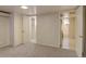 Finished basement with laundry area and access to a full bathroom at 782 Holly St, Denver, CO 80220