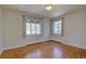 Bright bedroom with hardwood floors and two large windows offering ample natural light at 782 Holly St, Denver, CO 80220