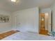 Comfortable bedroom with hardwood floors and an ensuite bathroom at 782 Holly St, Denver, CO 80220