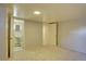 Neutral bedroom with two closets, and doorway to en-suite bathroom for added convenience at 782 Holly St, Denver, CO 80220