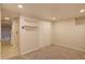 Bedroom featuring a closet with bi-fold doors, access to laundry area, and carpeted floor at 782 Holly St, Denver, CO 80220