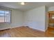 Bedroom features light hardwood floors, neutral walls and a window to let in natural light at 782 Holly St, Denver, CO 80220