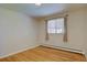 Cozy bedroom with hardwood floors and large window that provides lots of natural light at 782 Holly St, Denver, CO 80220