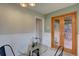 Bright dining area featuring double French doors and seamless flow to other spaces at 782 Holly St, Denver, CO 80220