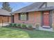 Close up of brick home exterior and yard at 782 Holly St, Denver, CO 80220