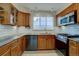 Well-maintained kitchen with stainless steel appliances, granite counters and wooden cabinets at 782 Holly St, Denver, CO 80220