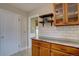 Bright kitchen featuring custom wood cabinets, floating shelves, and a subway tile backsplash at 782 Holly St, Denver, CO 80220