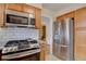 Modern kitchen featuring stainless steel appliances and white subway tile backsplash at 782 Holly St, Denver, CO 80220