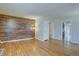 Bright living room featuring hardwood floors and an accent wall at 782 Holly St, Denver, CO 80220