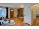 Bright living room with hardwood floors and a decorative wood accent wall at 782 Holly St, Denver, CO 80220