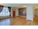 Bright living room featuring hardwood floors, a large window, and an accent wall at 782 Holly St, Denver, CO 80220
