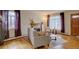 Comfortable living room showcasing hardwood floors, fireplace, and large windows for natural light at 782 Holly St, Denver, CO 80220